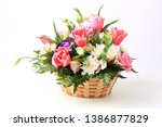 Basket Of Flowers Isolated On...