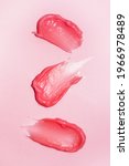 Small photo of Cosmetic smears on bright Pink background. Lipstick or lip gloss swatch macro wallpaper. Beauty swash texture. Liquid makeup product closeup. Vertical banner template