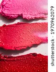 Small photo of Lipstick or lip gloss swatch macro wallpaper. Beauty swash texture. Liquid makeup product closeup. Cosmetic horizontal smears. Vertical banner template