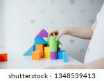 child hands playing with... | Shutterstock . vector #1348539413