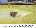 sulfur factory. tractor loading sulfur