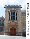 Small photo of Rugby, Warwickshire / UK - June 27th 2019: The main entrance to Rugby School on Lawrence Sheriff Street. This public school was made famous in Tom Brown's Schooldays and by William Webb Ellis.