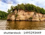 Rock formations along the Wisconsin river are seen by being on an upper dells boat tour.