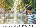 Small photo of Boys jumping in water fountains. Children playing with a city fountain on hot summer day. Happy friends having fun in fountain. Summer weather. Friendship, lifestyle and vacation.