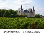 Small photo of Pichon Longueville, France-08 23 2013: The Chateau Pichon Longueville Baron in a vineyard landscape, Pichon Longueville is a winery in the Pauillac appellation of the Bordeaux region of France.