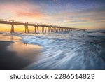 Small photo of Fishing Pier Navarre Beach Florida Sunrise. The Navarre Beach pier's is famous for is being the longest fishing pier in Florida, stretching 1,545 feet long and towering 30 feet above the water.