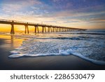 The Navarre Beach pier's is famous for is being the longest fishing pier in Florida, stretching 1,545 feet long and towering 30 feet above the water.