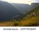 Small photo of Mountain river flowing in the valley, morning snick. Pass "Katu-Yaryk" and the valley of the river Chulishman. Siberia, Altai Mountains.