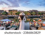 Small photo of Asian woman wearing vietnam culture traditional at Hoi An ancient town, Vietnam. Hoi An is one of the most popular destinations in Vietnam from Korea, Thailand, USA, Japan, China