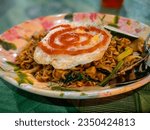Small photo of delicious fried meggi mee with fried egg