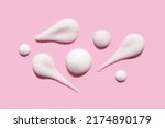 Small photo of texture foam mousse foam cosmetic smear sample on pink background