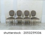 Four Brown Antique Chairs Stand ...