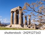 Small photo of Doric colonnade Temple of Apollo in Ancient Corinth, beautiful mountains and Peloponnessian landscape at background. Corinth, Greece