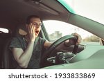 Small photo of Drunk driver yawning and falling asleep rushes at high speed along road, breaking the rules and speeding violation. Drug intoxication while driving in motion. Problems and risk of accident.
