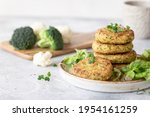 veggie burgers with quinoa, broccoli, cauliflower served with salad. plant based food. space for text