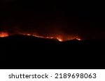 Small photo of Borja, Spain - Aug 13, 2022: View of forest fire flames in the Moncayo, devouring hills and trees with virulence, thanks to hurricane force winds and drought