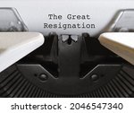 Old classic vintage typewriter with typed text THE GREAT RESIGNATION, a mass voluntary exodus from the workforce - millions workers are quitting their jobs.