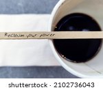 Small photo of Wood coffee stirrer with handwritten text Reclaim Your Power, self talk affirmation to encourage people who tired of feeling stuck in career or relationship, to reclaim power and reinvent their life