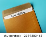 Office envelope and document with handwritten text QUIET QUITTING, when employees not engaged or taking job seriously, do minimum required but focus on job outside office