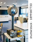 Small photo of Van de Graaff generator: an electrostatic generator which produces very high voltage direct current (DC) electricity at low current levels. Used as demonstration in physics class.