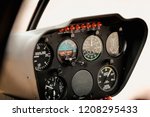 Controls And Gauges In The Cockpit Of A Small Private Helicopter Preparing For Takeoff