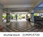 Small photo of Hyderabad,India- August 6th 2022; Stock photo of residential building parking area. Two wheelers, bicycle and four wheeler vehicles parked properly.Picture captured during day time under natural light