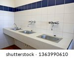 Modern sanitary room  and sanitary facilities in a public building, Germany, Europe
The public, clean sanitary room has a large selection of sinks with mirrors, hairdryers, sinks and shower stalls.