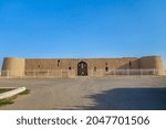 Small photo of Facade of a medieval caravanserai or palace Kyr Kyz (Fortress of 40 girls), Termez, Uzbekistan. The two-storey building was built in the 9th century
