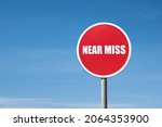 'near miss' sign in red round...