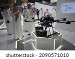 Small photo of Dubai, UAE - November 14, 2021: AEC exhibitor pavilion at Dubai Airshow 2021. AEC is a Saudi Arabian Military Industries (SAMI) company dealing in electronics, manufacturing, and MRO services.