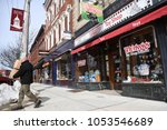 Small photo of Exeter, N.H./USA - March 23, 2018: A man carries boxes out of Whirlygigs, a small toy store in downtown Exeter, N.H. Independent toy stores have outlived Toys R Us and compete with Amazon.com.