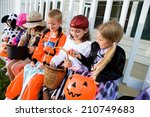 Halloween  kids sit on porch...