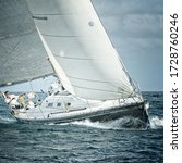 Small photo of Yachtsman maneuvers on sailing yacht regatta