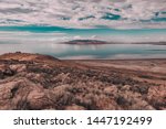 Views of Great Salt Lake at Antelope Island State Park, Utah, USA. Desert landscape, water reflections, dramatic clouds.  