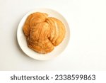 Small photo of deep fried curry puff,curry puff pastry, karipap,epok epok, spiral curry puff isolated a white backdrop . thai curry puff concept.this pastry is asian traditional snacks