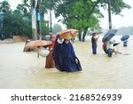 Small photo of Sylhet Bangladesh 17 Jun 2022: The flood situation in Sylhet has flooded roads and houses. People’s are going to safe place.