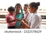 Small photo of Beawar, Rajasthan, India, June 25, 2023: Health worker administers a polio vaccine to a child during a Pulse Polio immunisation drive at railway station in Beawar.