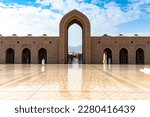 Small photo of Muscat, Oman - March 16, 2023: Amazing view of the arcades of the Grand Mosque of Sultan Qaboos in Muscat, Oman. Beautiful Islamic architecture.