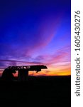 Small photo of Incredible very colorful sunset in the countryside. Silhouette of an industrial agricultural machine against the day. Cumulonimbus and stratus in a beautiful sky at night.