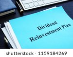Dividend Reinvestment Plan - DRIP on the desk.