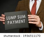 Small photo of A man in a suit holds an inscription Lump sum payment.