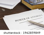 Small photo of Power of attorney POA legal document and pen.