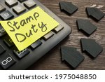 Memo stamp duty land tax on the black calculator.