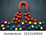 The magnet attracts colored cubes. Leads generation and acquisition concept.