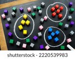 Small photo of Customer segmentation models concept. Segments with colorful cubes.