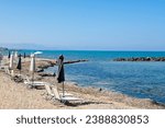 Small photo of Beautiful Crete island, Greece. Charming coastal village of Kokkini Hani. Popular tourist destination with sandy beaches and a quiet laid back atmosphere. Beach scene by the Aegean sea.