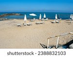 Small photo of Beautiful Crete island, Greece. Charming coastal village of Kokkini Hani. Popular tourist destination with sandy beaches and a quiet laid back atmosphere. Summer seaside scene.