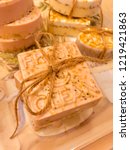 Small photo of Handmade soaps range in color and texture and vary in fresh natural ingredients. Make it special and wrap it up with twine. Great for projects, holidays, backgrounds, and advertising.