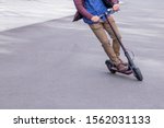 Guy leaning into a sharp turn on electric scooter
