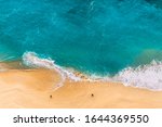Beautiful Indian ocean, Bali, Indonesia. Beautiful sandy beach with turquoise sea. Drone view of tropical turquoise ocean beach Nusa penida Bali Indonesia. Coast as a background from top view. 